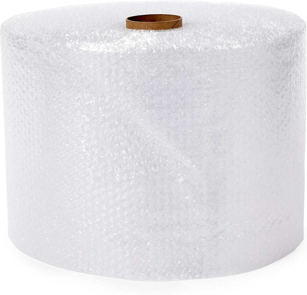 A large roll of clear bubble wrap with a small brown cardboard core visible at the top, photographed on a plain white background.